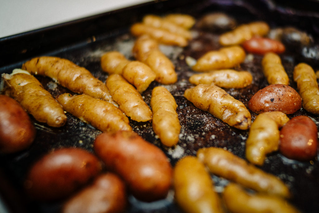 roasting potatoes on a dark pan helps promote browning