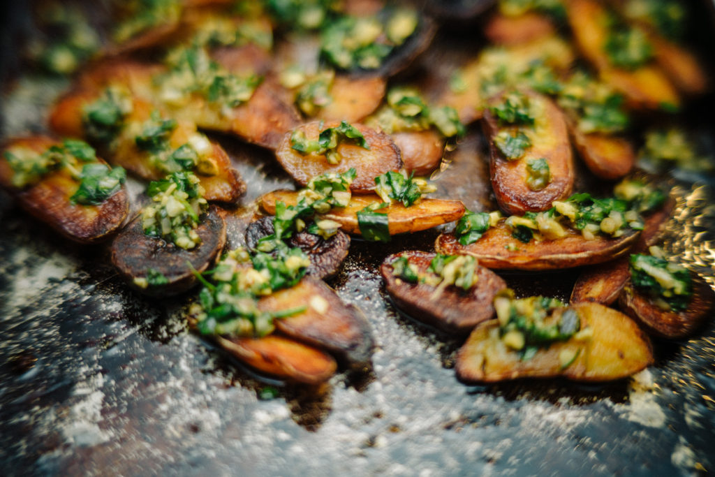 Crispy Fingerling Potatoes topped with a salsa verde