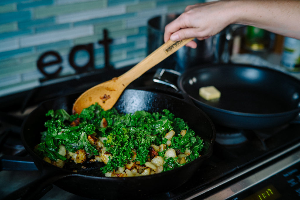 adding kale to breakfast hash for extra flavors and nutrients