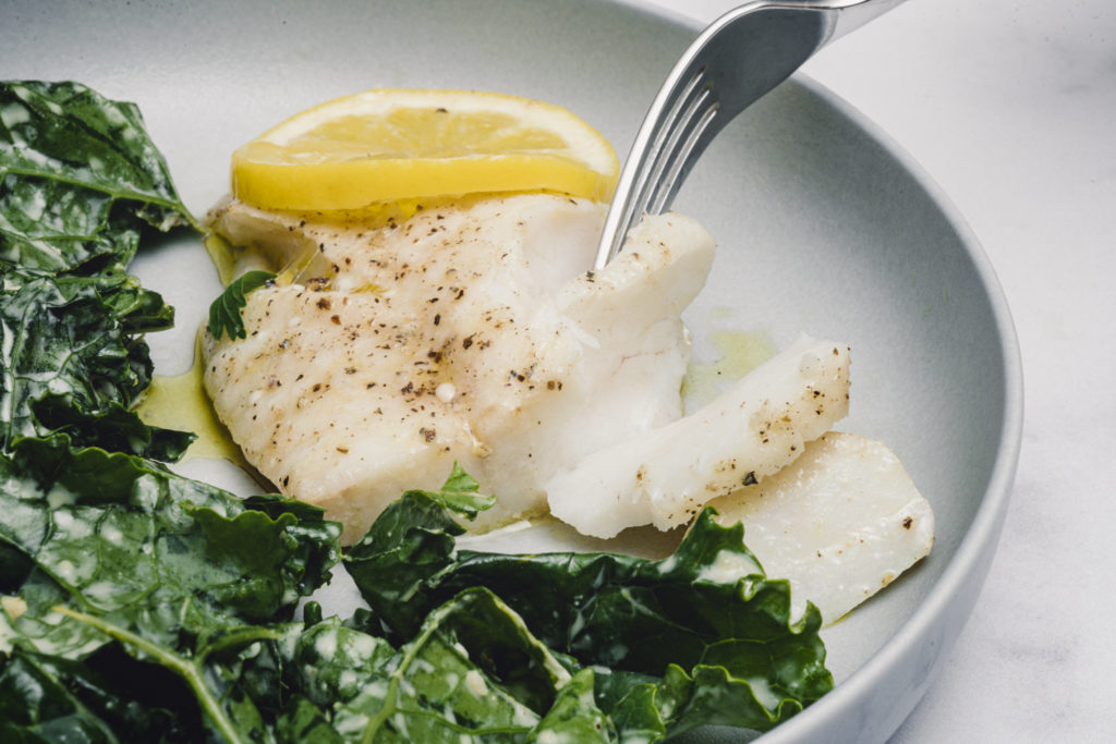 olive oil poached fish is buttery, flakey and delicious