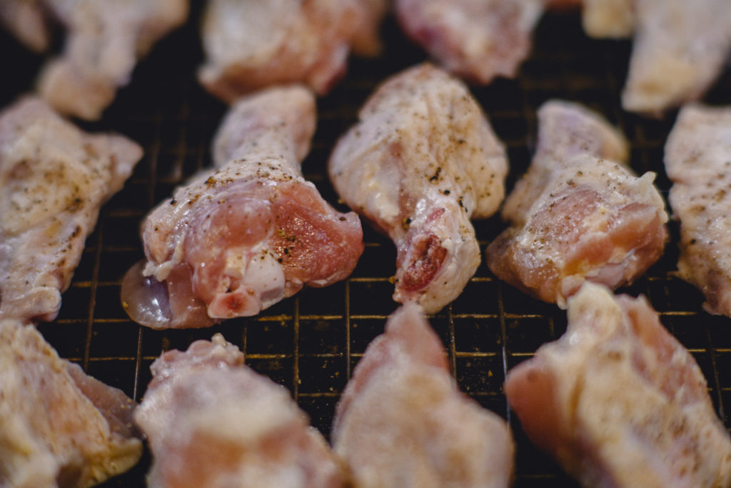 dry out wings in the fridge before cooking to get crispy skin
