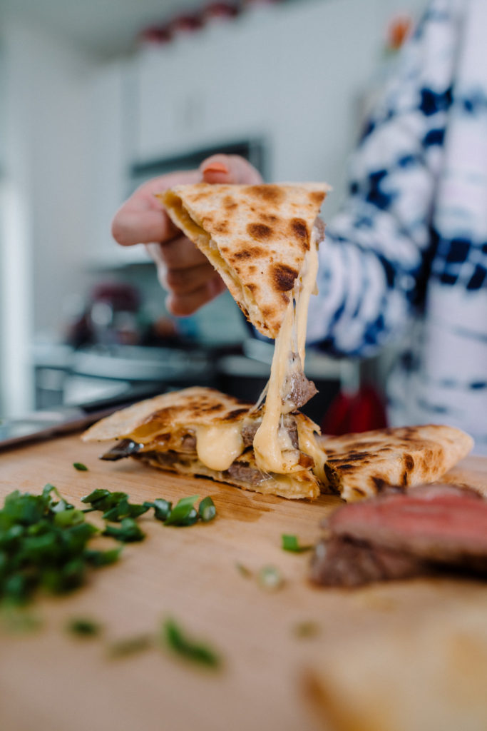 quesadillas with steak, gouda caramelized onions, and chipotle lime crema
